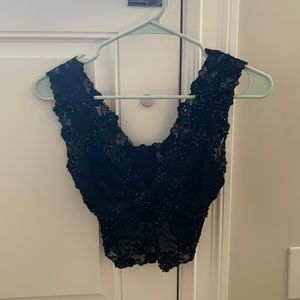 This is a black cropped top from Bebe. Size S